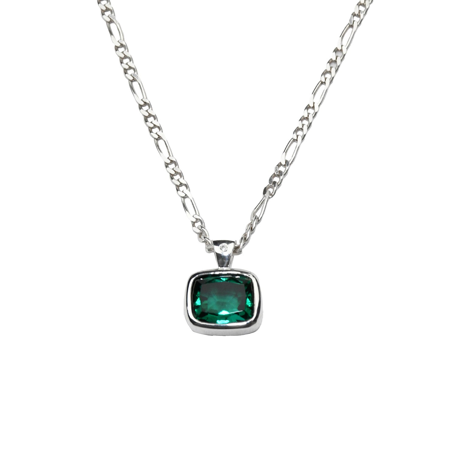 close up of pendant: laura miers silver necklace with bezel encased, emerald cut hyrdothermal emerald pendant