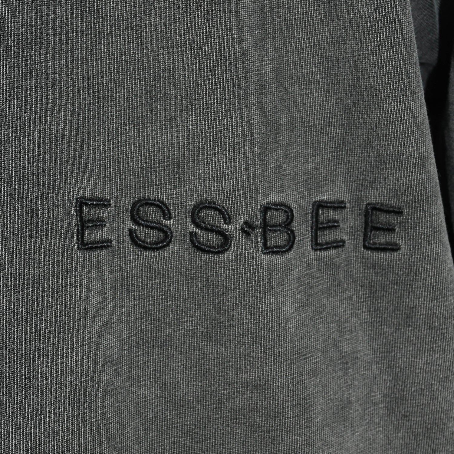 ESS.BEE embroidered logo on side of t-shirt