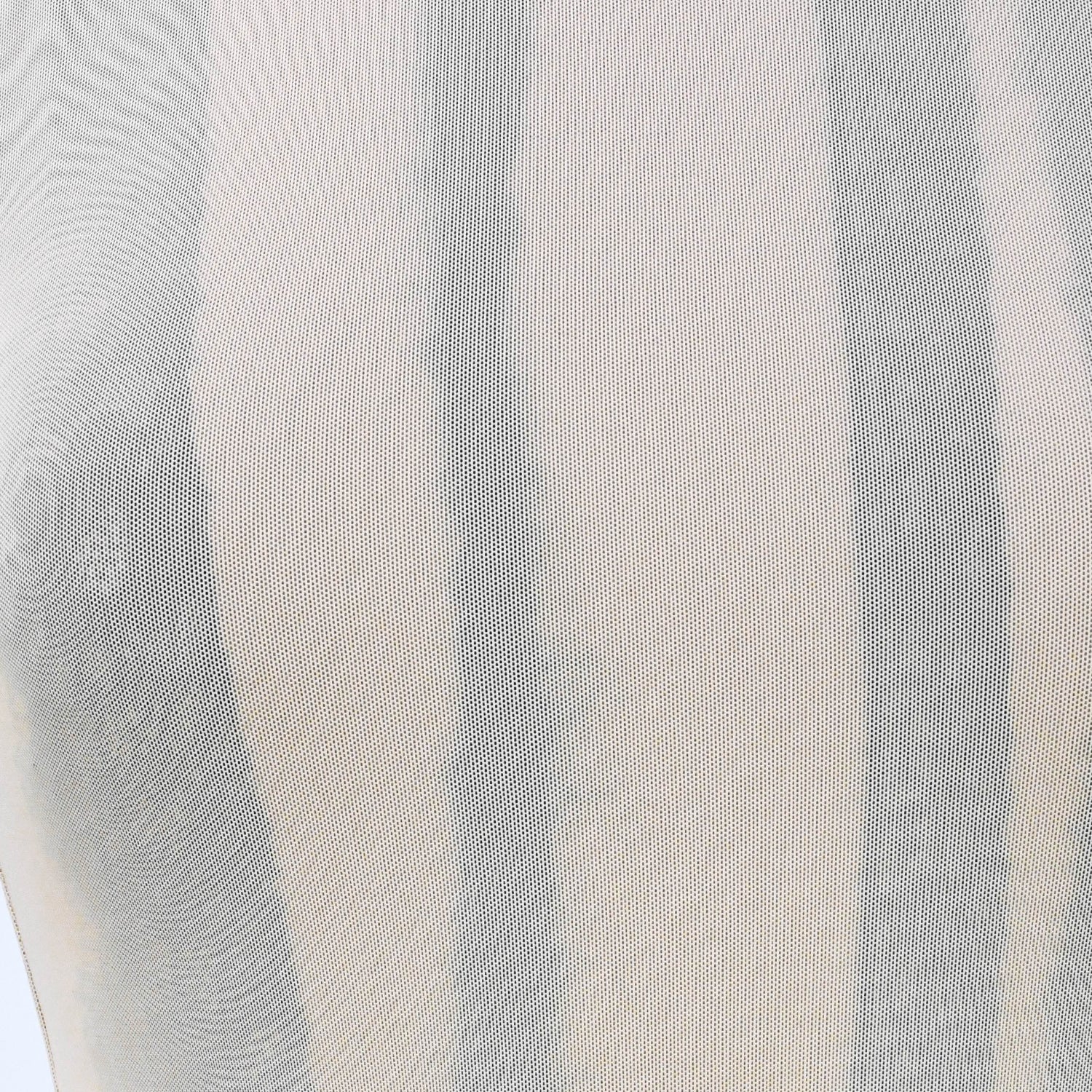 close up of greta garmel tank with peach mesh overlay and black lace detailing with taupe jersey underlay