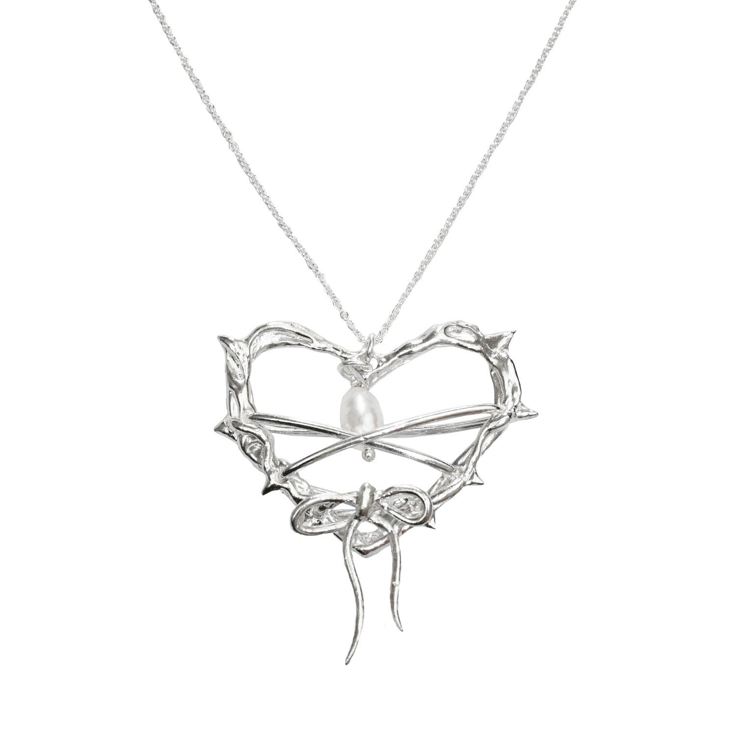 close up of heart shaped pendant and moonstone gemstone hanging inside