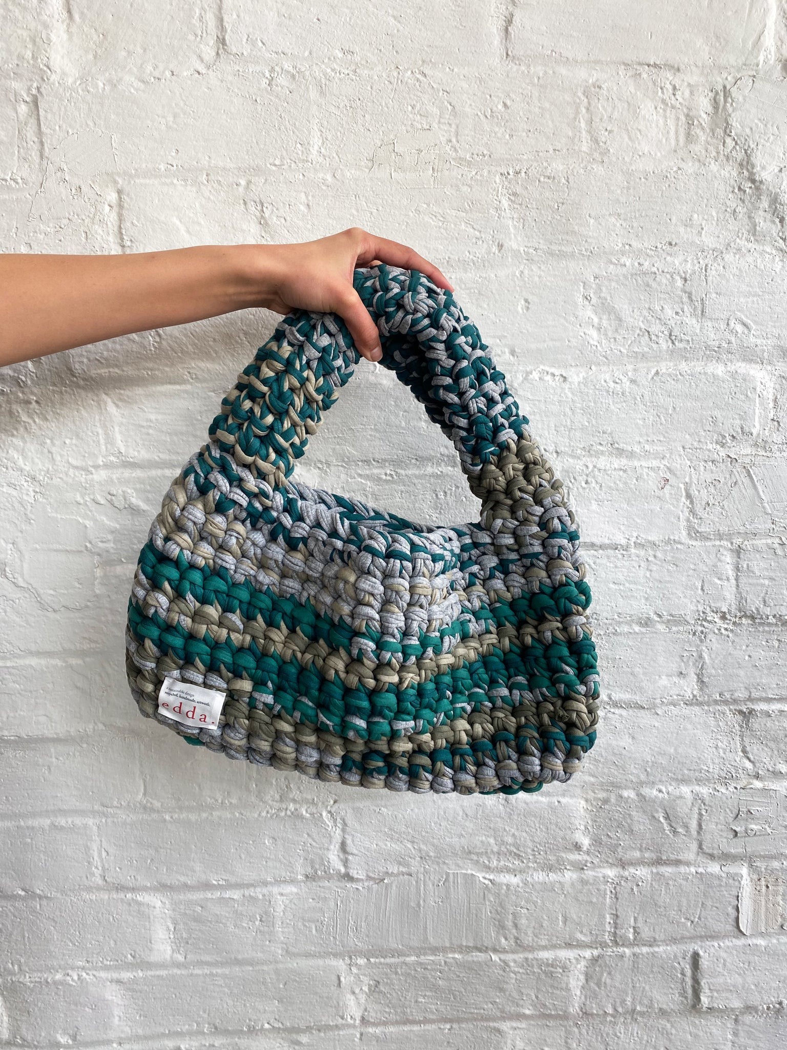 Edda - Medium Slouchy Grey/ Green - Error404store. Knitted/weaved blue and green handbag. Sustainably handmade from recycled t-short material by Denmark designers Edda. Sold in Melbourne clothing boutique Error404store.
