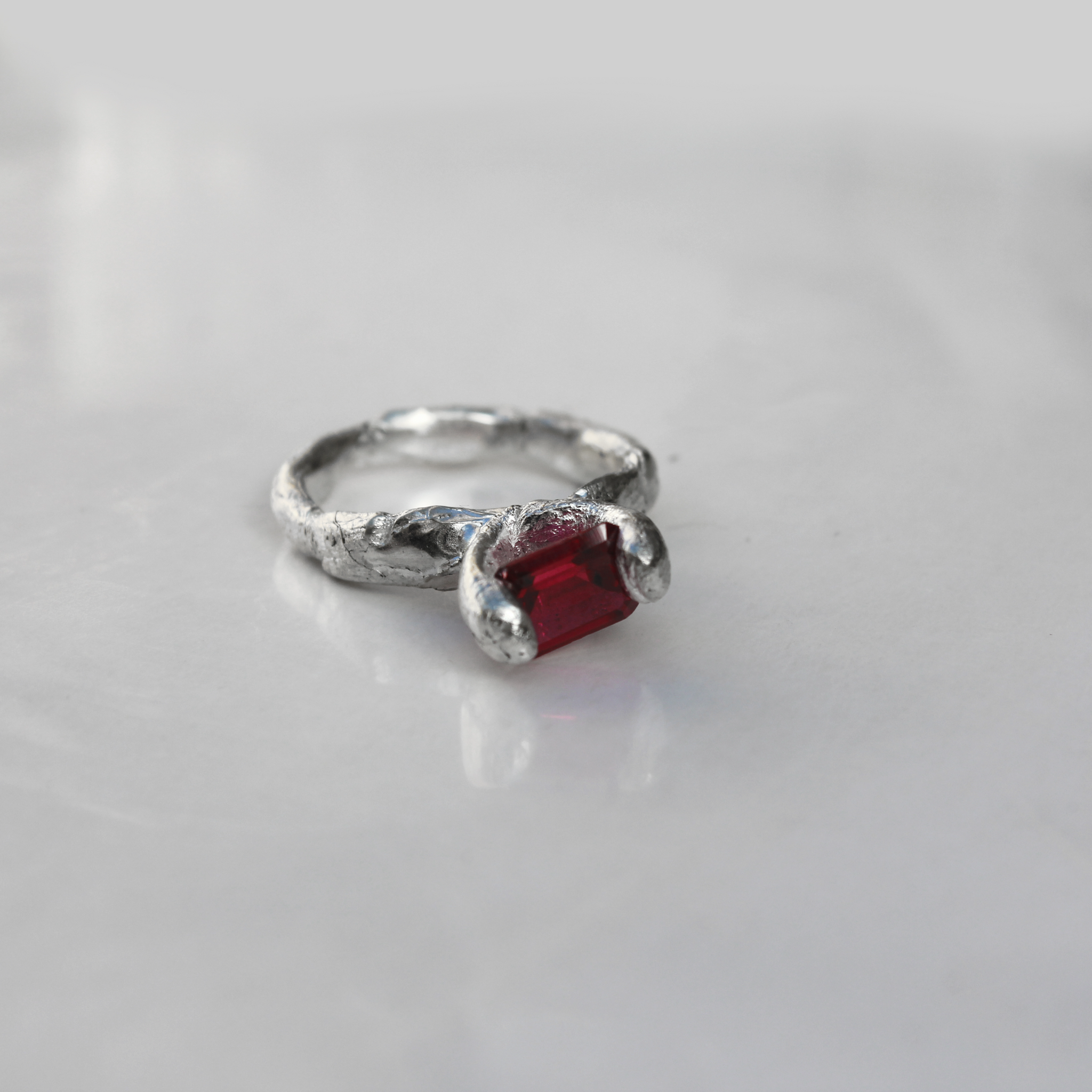 Handmade silver ring with central ruby gem. Made sustainably by emerging Melbourne jeweller called Garage bands. 